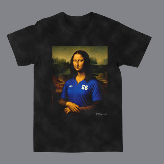 A black short-sleeve t-shirt featuring a custom graphic print of the Mona Lisa wearing a blue soccer jersey with 'ES' on the chest and the Umbro logo. The t-shirt is displayed flat against a solid gray background.
