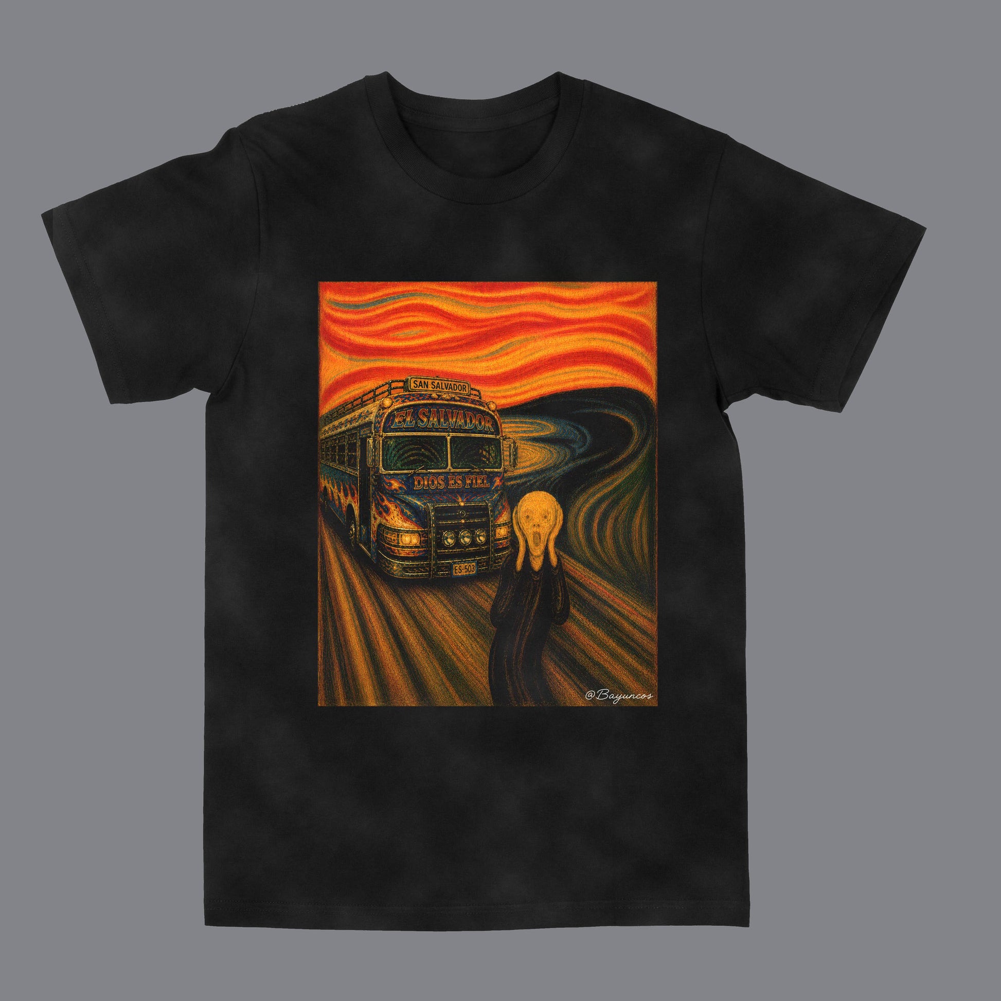 A black short-sleeve crewneck t-shirt featuring a large graphic print on the front. The print is a parody of Edvard Munch's 'The Scream' with a red and orange screaming face, a Salvadoran microbus bus, and a blonde figure on a swirling road.