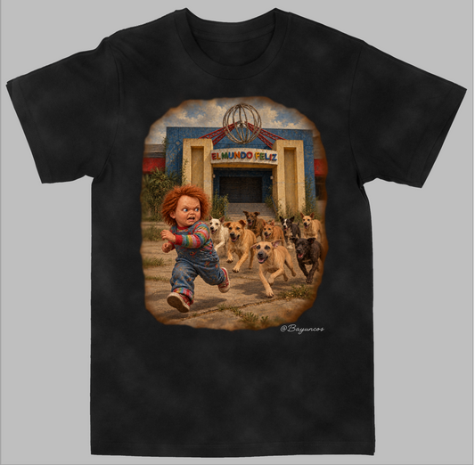 A black short-sleeve t-shirt with a large graphic print on the front depicting Chucky running with a herd of dogs in front of El Mundo Feliz. The t-shirt is displayed flat against a solid gray background.